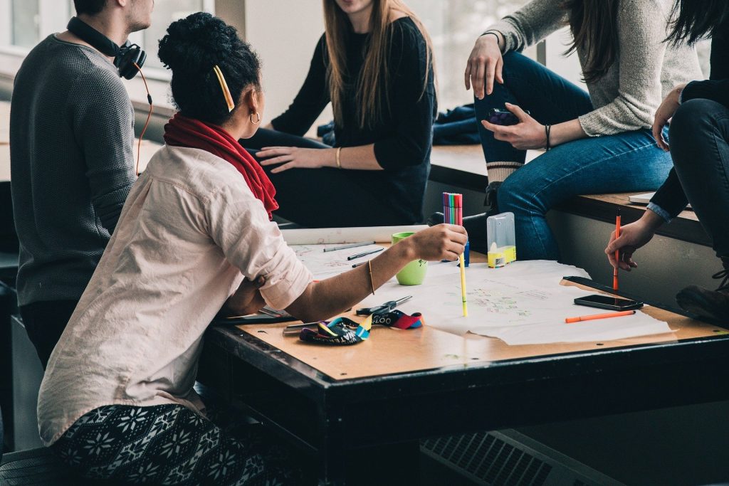 A group of students study together at a table