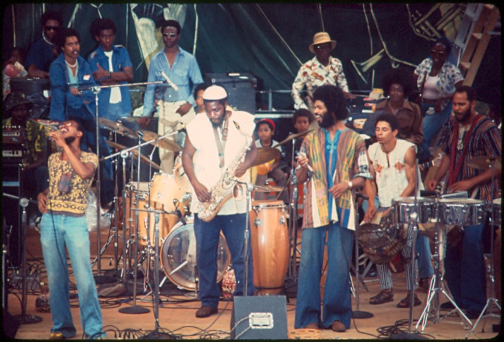 Gil Scott-Heron performs onstage at the Afro-American (AFRAM) Exposition, Hopkins Plaza, Baltimore MD